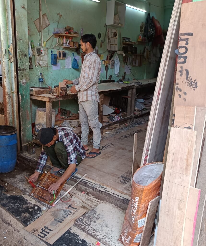skilled furniture workers manufacturing custom furniture in workshop