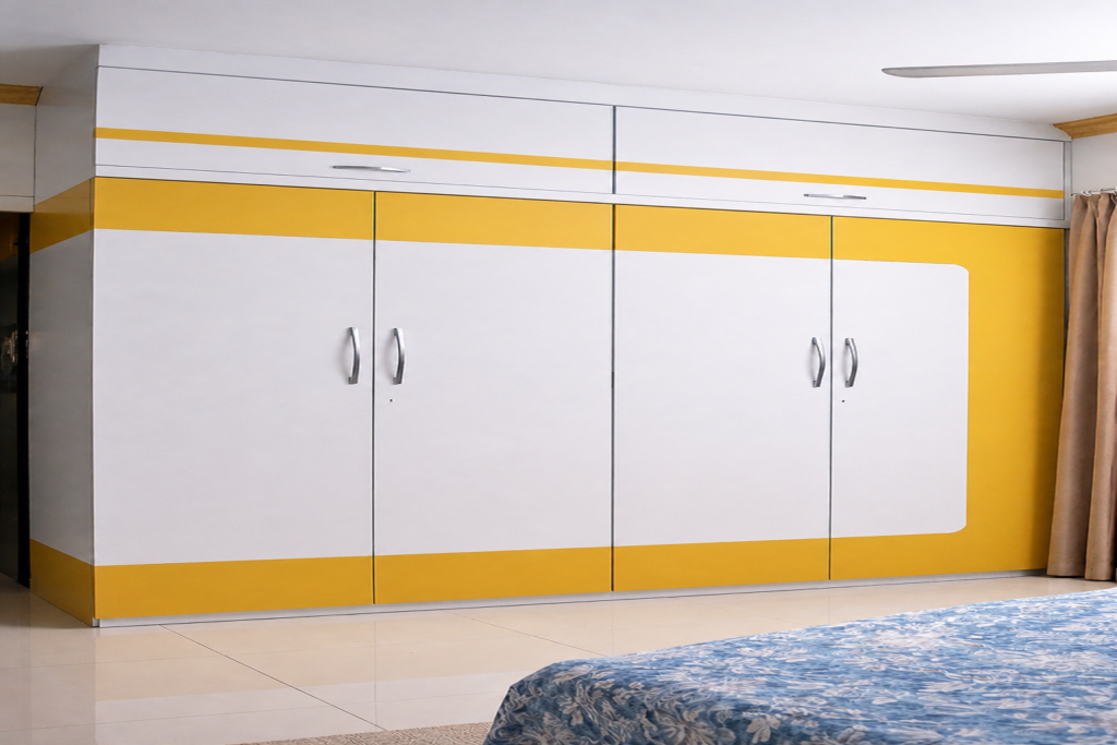 Modern modular wardrobe with yellow and white panels, spacious storage cabinets and sleek bedroom interior